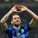 Selebrasi Hakan Calhanoglu dalam laga Liga Champions antara Inter Milan vs Feyenoord, Rabu (12/3/2025). (c) AP Photo/Luca Bruno