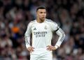 Kylian Mbappe absen bela Real Madrid lawan Benfica akibat cedera lutut kambuhan; ia diperkirakan menepi 10 hari demi menghindari risiko jangka panjang.-Aitor Alcade-Getty Images