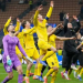 Para pemain Bodo/Glimt merayakan kemenangan di akhir pertandingan sepak bola babak play-off Liga Champions antara Inter Milan dan Bodo Glimt, di stadion San Siro di Milan, Italia, Selasa, 24 Februari 2026. (Sumber: AP Photo/Luca Bruno)